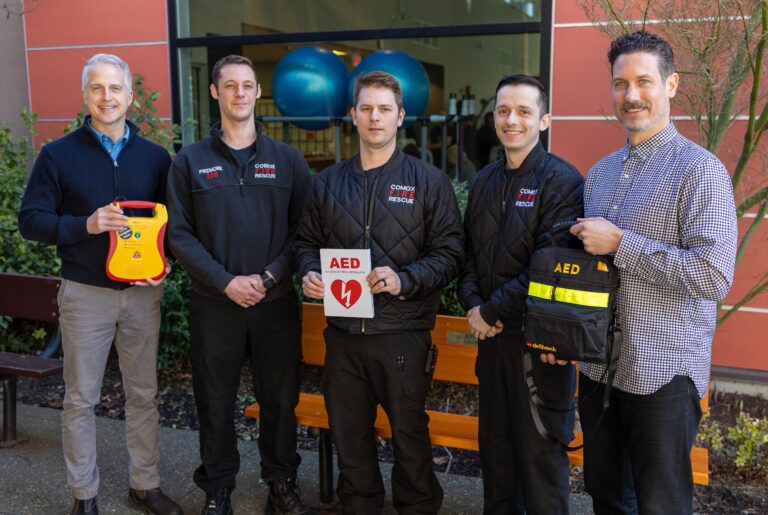 Firefighters donate new defibrillator to Comox Community Centre